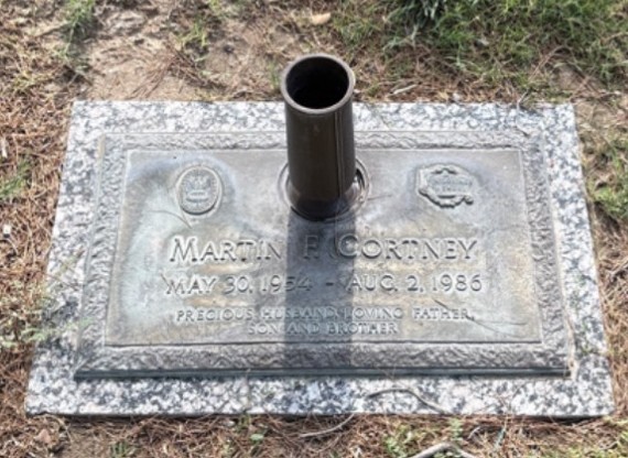Martin's headstone before restoration — inscription faded with age